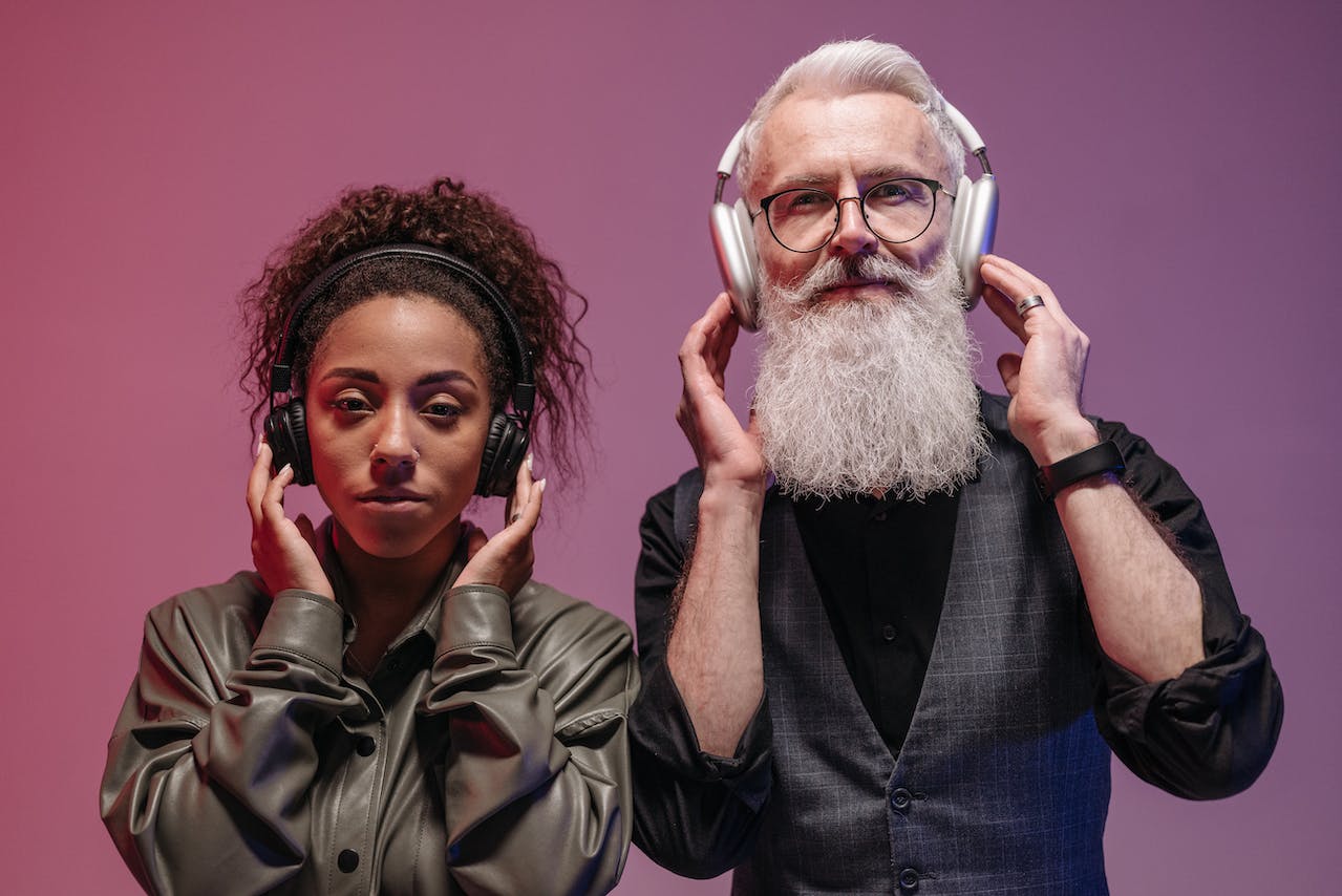 dark lady and older white man wearing headphone